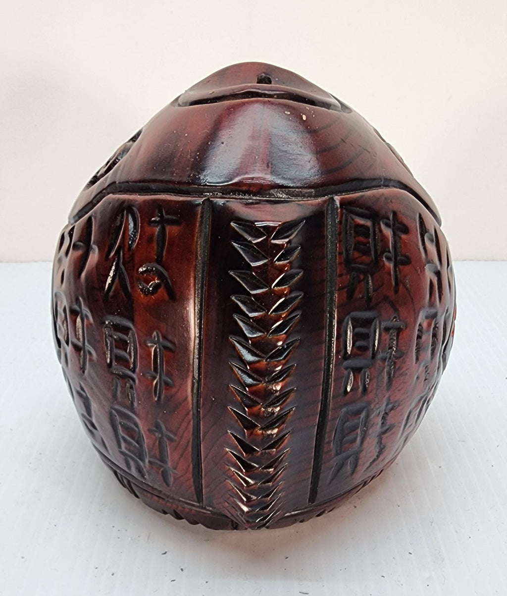 Hand-carved wooden piggy bank