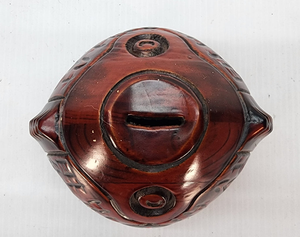Hand-carved wooden piggy bank